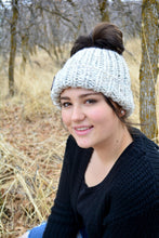 Load image into Gallery viewer, Chunky Messy Bun Beanie, Messy Bun Hat, Ponytail Hat, Handmade Crochet Ponytail Hat, Shown Here In Wheat | Choose Your Color
