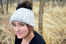 Load image into Gallery viewer, Chunky Messy Bun Beanie, Messy Bun Hat, Ponytail Hat, Handmade Crochet Ponytail Hat, Shown Here In Wheat | Choose Your Color
